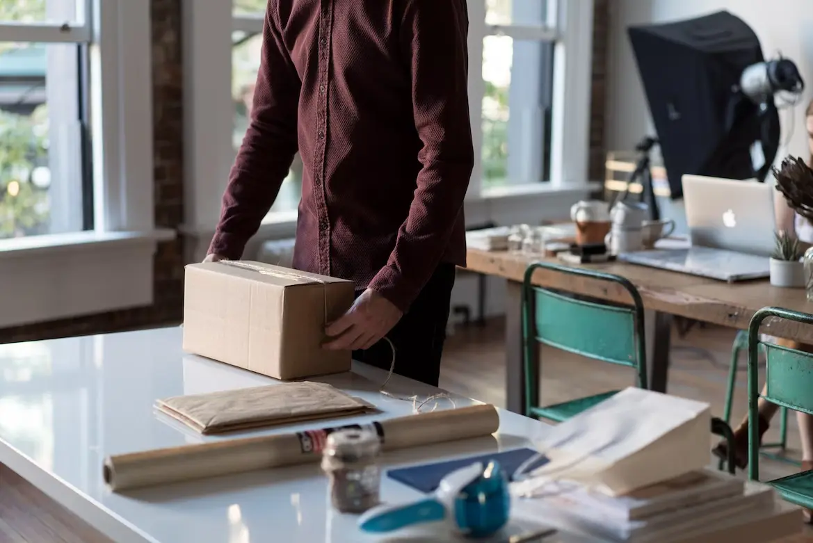 Man shipping a package and multilingual websites